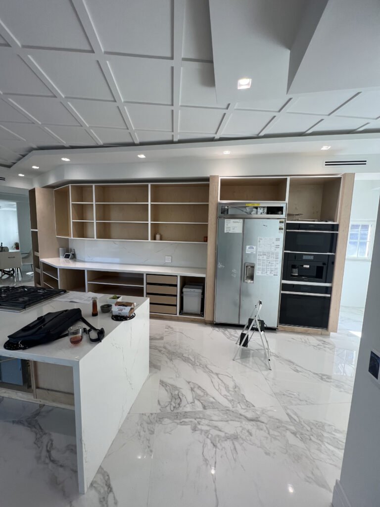 frameless flat-panel cabinets with quartz island Rancho Santa Fe