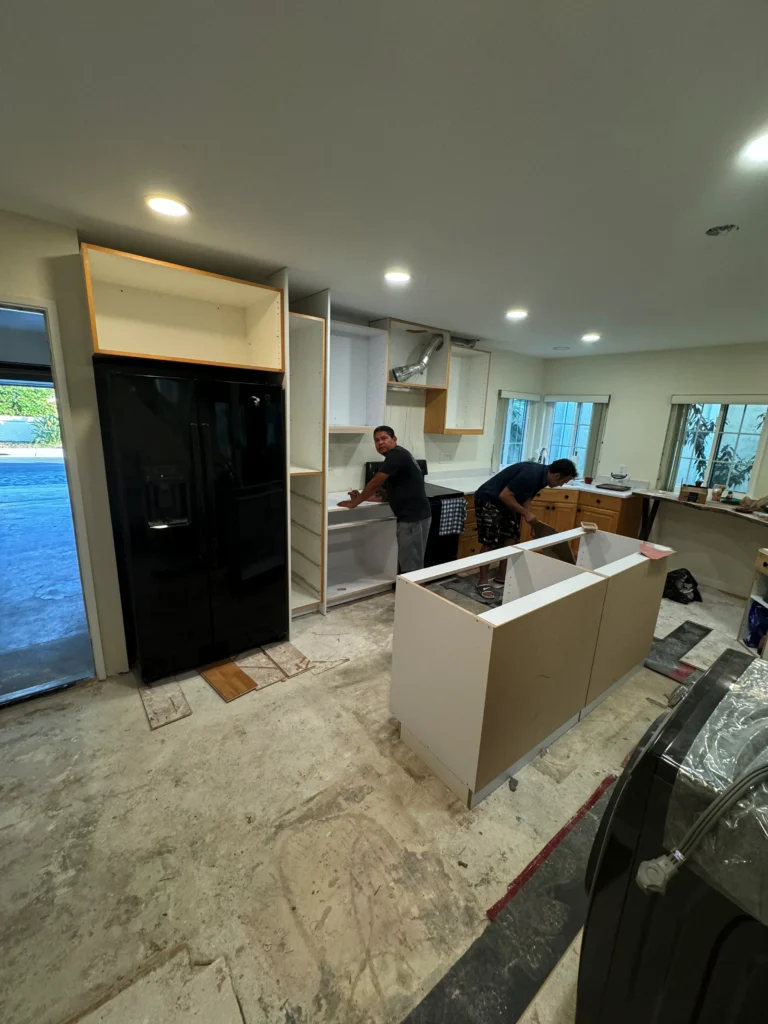 custom kitchen island with white European cabinets La Jolla