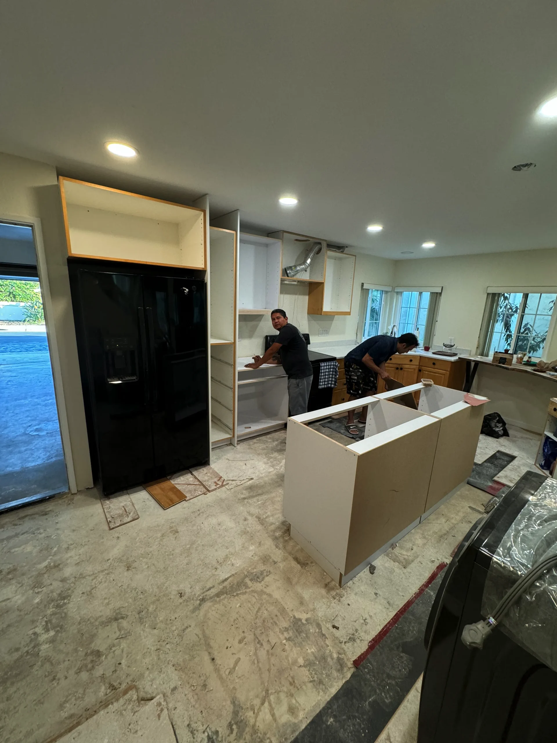 custom kitchen island with white European cabinets La Jolla