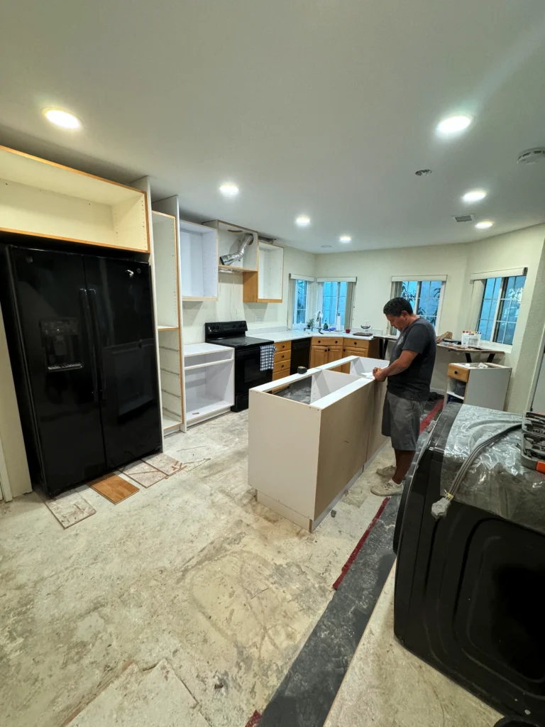 custom kitchen island with white European cabinets La Jolla