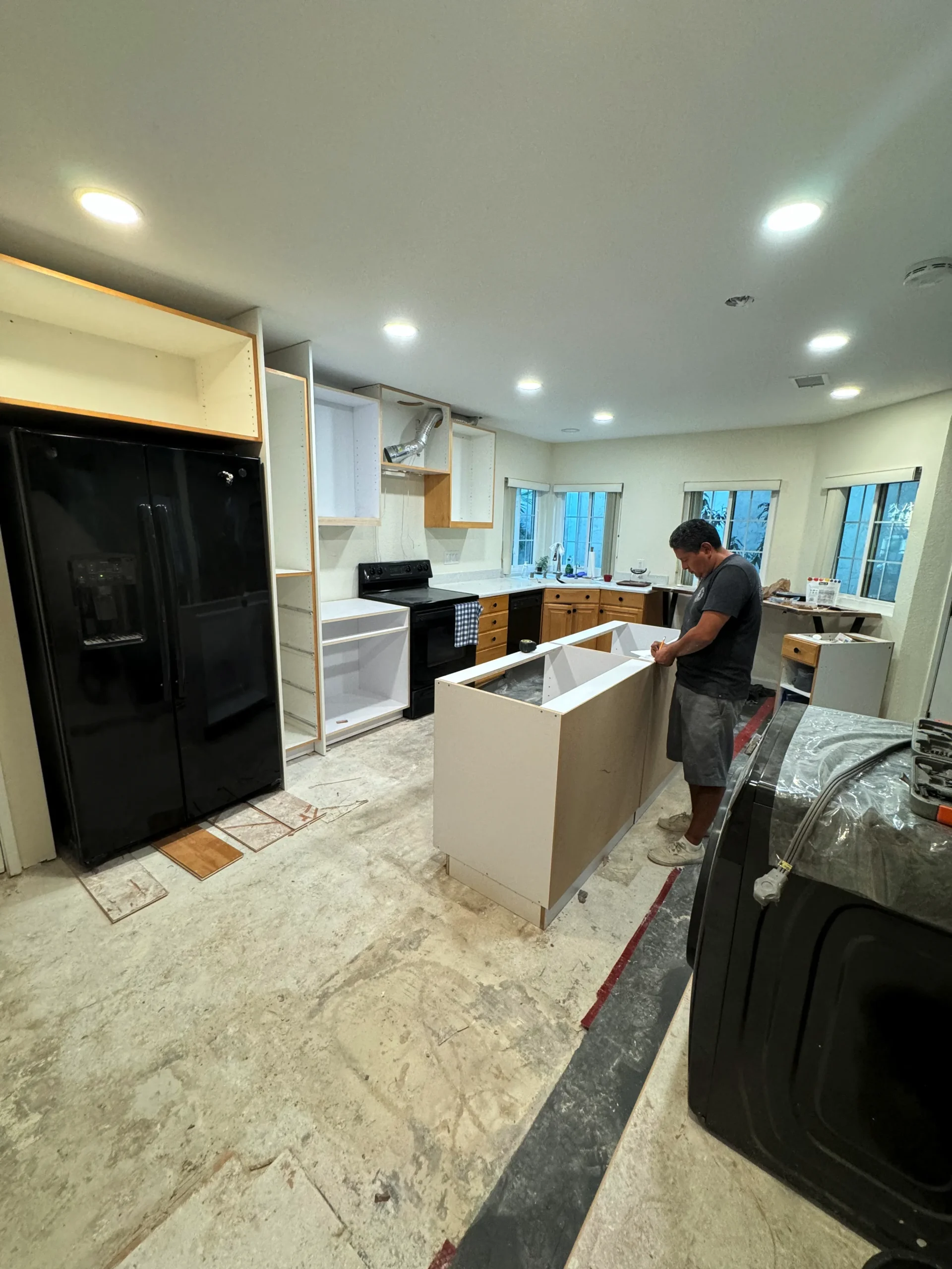 custom kitchen island with white European cabinets La Jolla