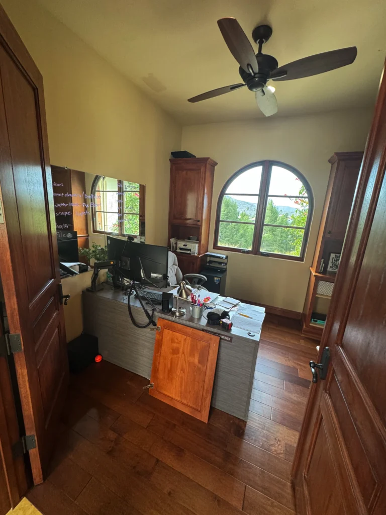 executive home office built around an arched window