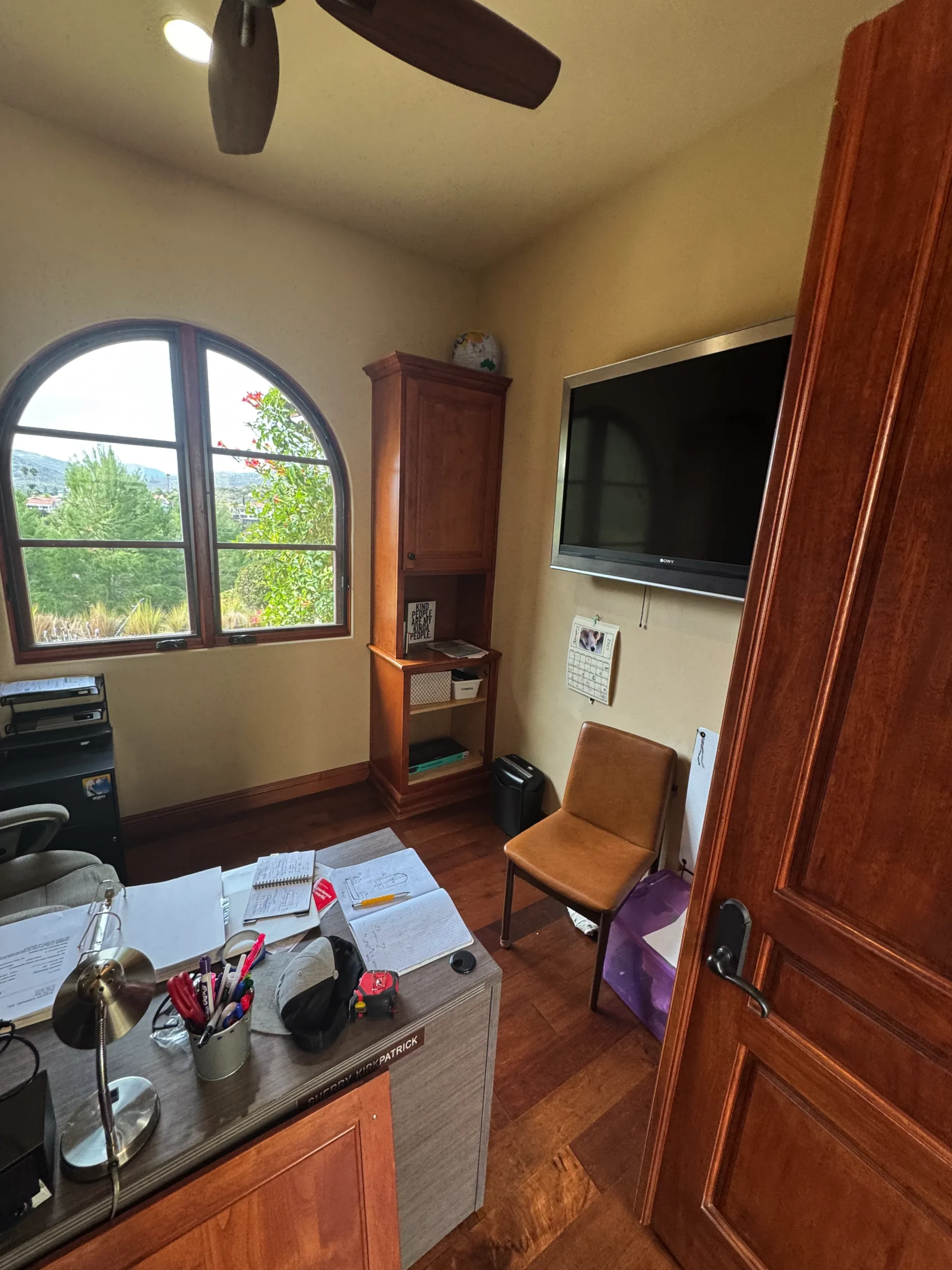 executive home office built around an arched window