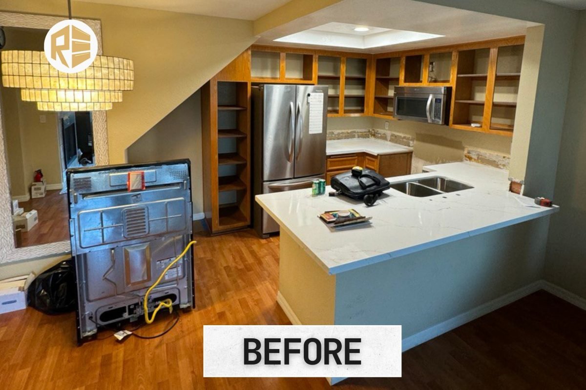 Craftsman assembling custom cabinetry for a kitchen