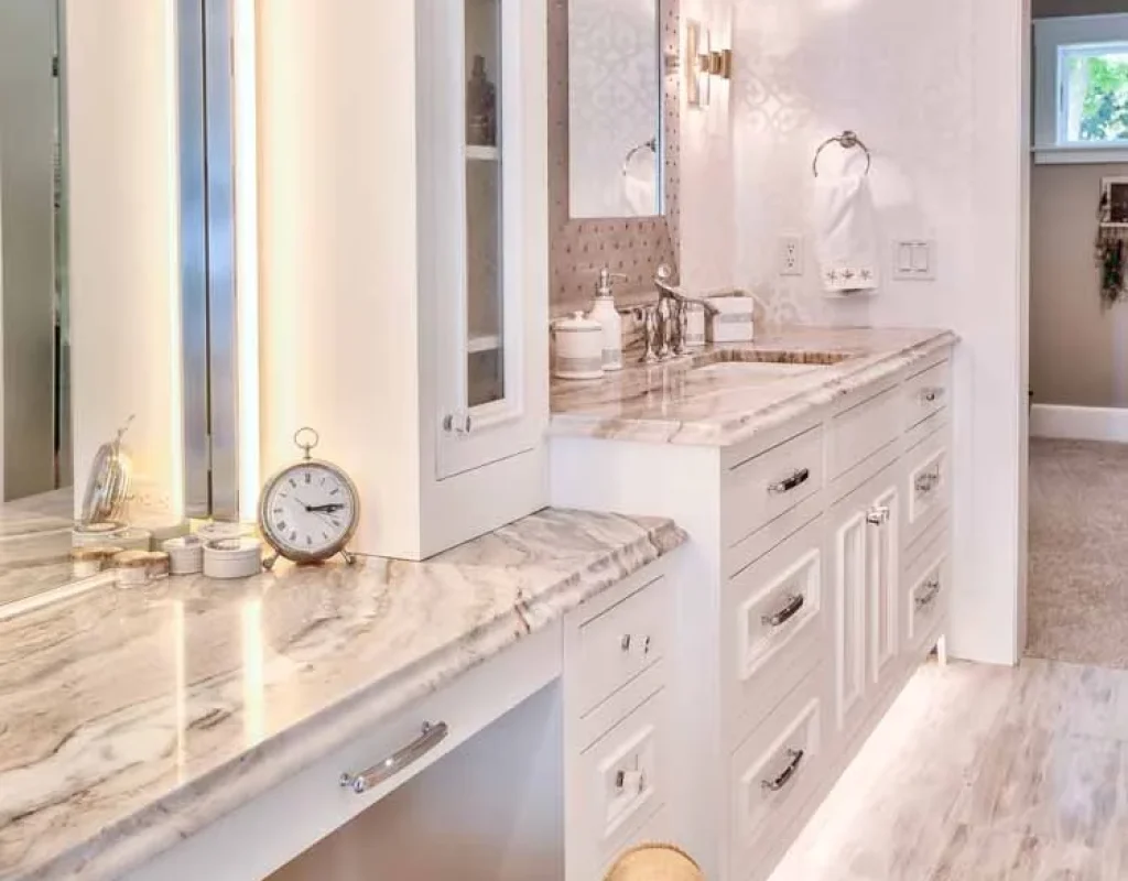 Craftsman installing luxury bathroom cabinets in Carlsbad, CA home