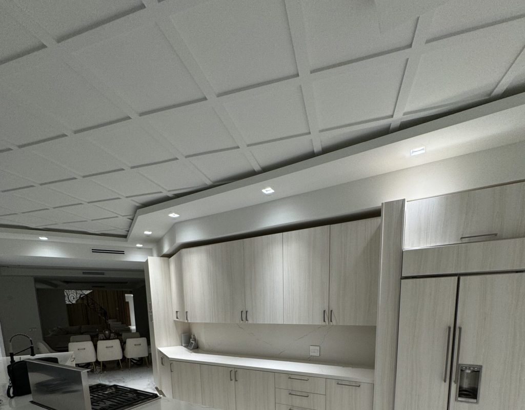 Elegant wood cabinets with under-cabinet lighting and matte black hardware