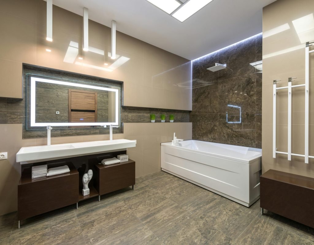 Contemporary bathroom showcasing elegant fixtures, spacious layout, and stylish lighting.